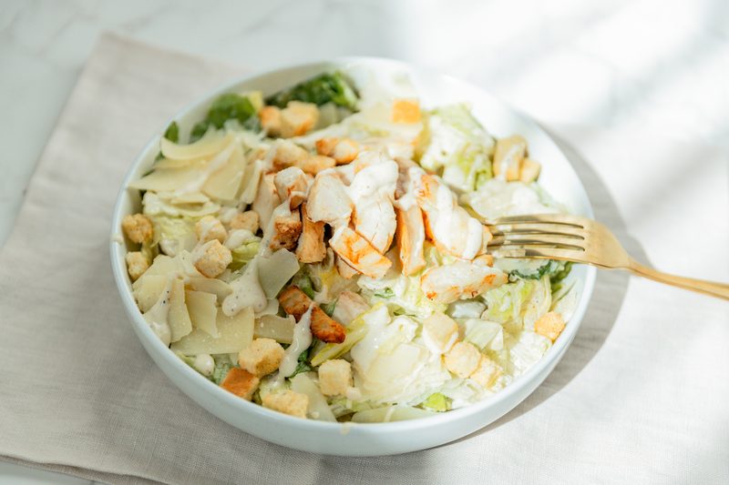 Pastaphony Tustin — chicken caesar salad with shaved parmesan and croutons